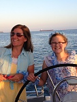 My sis and niece went with me to Catalina Island. 
Niece can hold a course with the best! 
Here we are sailing around Long Beach after dinner.