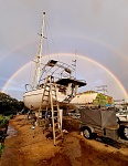 Painnting between rain squalls  
Rainbow over the horizon