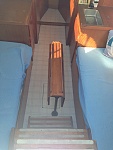 Table is mounted on bronze pipes that unscrew. Two leaves fold up. The space between bunks and between galley is where I was thinking of laying a...