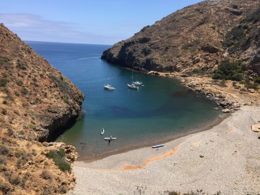 Fry's Harbor, or Fry's Anchorage, Santa Cruz Island. The three boats are in about the best location but there is room for one or two more next to wall on left. And there is room farther out too. Holding ground is all good: soft sand. Many folks anchor bow-in due to night winds coming down the canyon in the wee hours.