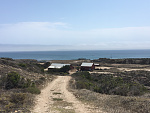 Ranch at Becher's Bay, Santa Rosa island, looking east. Pier is center in photo. Anchoring in sand east and south of pier is secure and wind...