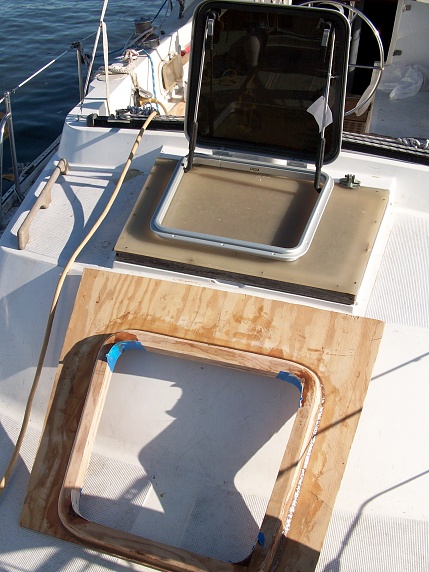 New Bomar aft hatch to replace dull plexiglass and wood original. The new marine grade plywood hatch combing is preassembled and ready for installation.