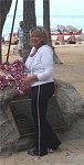 Waikiki Beach, adding a Lei to the statue of Duke Kahanamoku.