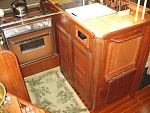 Galley, 3 burner stove, double stainless sinks and stowage