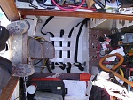 View from aft cabin companionway showing bilge and adjacent chaos.  Batteries are easily positioned with the halyard after the box is installed.