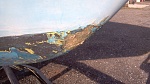 hull damage. I chipped out the fractured gel-coat prior to this picture