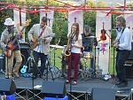 Me on the left with my band playing a concert in the grounds of Ford Park, Blues/ reggae, roots sort of band